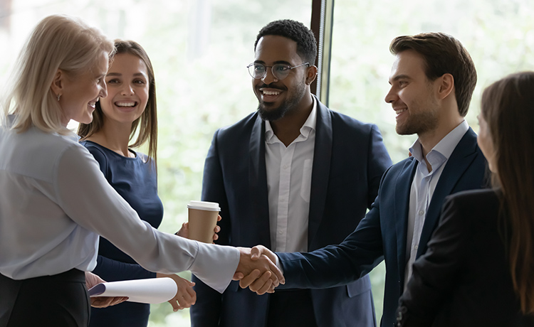 business meeting, and two people shaking hands
